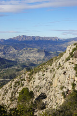 The mountain panorama opening from the hiking path to Puig Ca Campana, Finestrat, Spain  