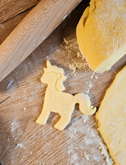 Pony Cookie Prep: Dough, Cutter, Rolling Pin, baking pony biscuits. High quality photo