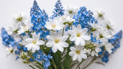 Obraz premium White and blue flower bouquet on white background with copy space for text