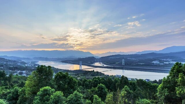 time lapse of the three gorges water control project in dusk to night , the Three Gorges Dam and Three Gorges Ship Lock with Xiling Yangtze River Bridge ,Yichang city, Hubei province, China