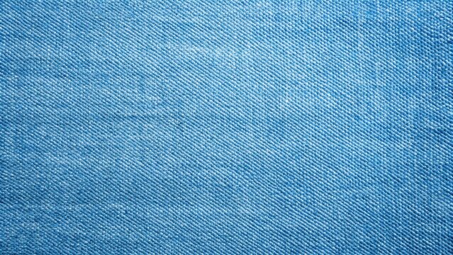 Softly lit denim fabric with subtle weave texture, showcasing the intricate stitching and color gradient, ideal for fashion or textile projects, texture, light blue