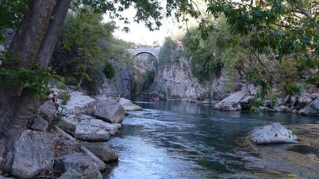 Historical Oluk Bridge. Koprulu Canyon ( Koprulu Canyon ) national park. Koprucay River. Tourist symbols of Antalya. Travelling to Turkey country - 4k video 