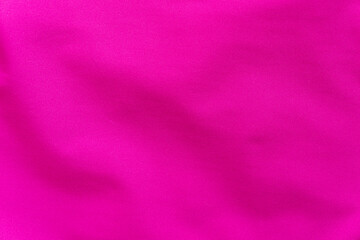 Wrinkled pink synthetic fabric as texture, background