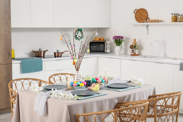 Interior of modern kitchen with festive table serving for Easter celebration