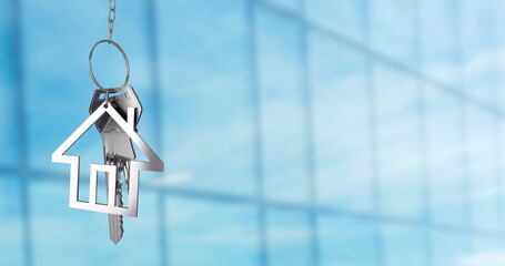 House-shaped keychain with keys image over blurred glass building background