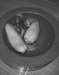 Black and white, closeup of fresh jackfruit in a purple plastic plate. Jackfruit sweet and high...