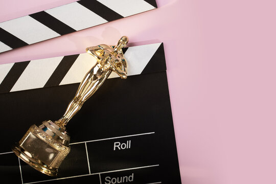 Oscar award on pink background, female award, cinema success and recognition,Moscow, Russia, January 21, 2025