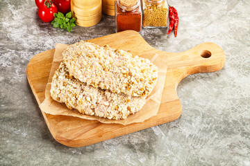Breaded raw breaded meat schnitzel
