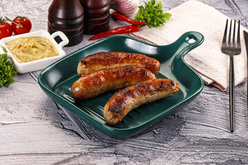 Delicous natural roasted sausages in the plate