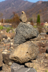 A small stone tower standing in a field