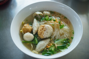 Fish line in white bowl, Fish ball noodle soup recipe. Top view