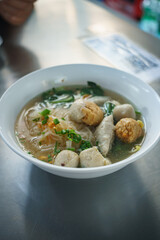 Fish line in white bowl, Fish ball noodle soup recipe. Top view