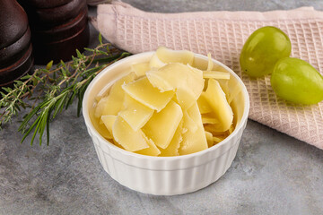 Parmesan cheese slices in the bowl