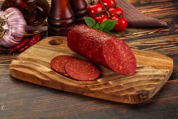 Spicy pepperoni sausages with sliced piece