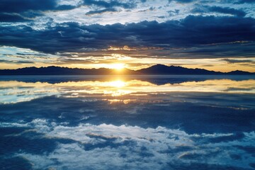 Fototapeta premium A serene sunset scene with calm waters and distant trees