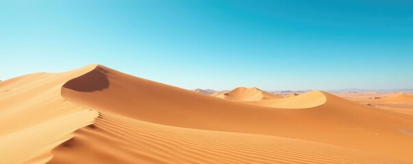 Majestic sand dune landscape under bright blue sky, expansive, vast, blue sky