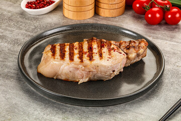 Grilled pork loin steak with bone