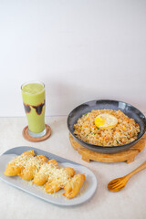 Delicious Combination Of Fried Rice With Egg, Crispy Fried Banana With Cheese, And Refreshing Avocado Juice With Chocolate Syrup.