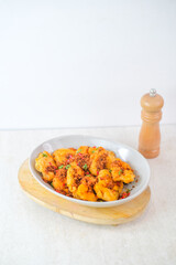 Fried Eggplant Topped With Flavorful Beef Floss Served In A Bowl, Garnished With Fresh Herbs And Red Chili For A Savory And Spicy Culinary Delight.