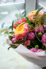 A lower bouquet of garden plants with shades of hot and erysipelas, supplemented with eucalyptus and pivonia buds. aesthetic compositions. Bright bouquet