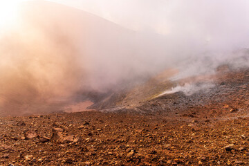 Aerial landscape view of volcano crater with smoke coming. An active erupting volcano with fumaroles in Italy, Enta and Stromboli