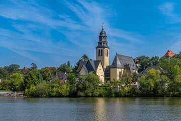 The Main river bank and Sacred Heart Church, Kelsterbach am Main, Hesse, Germany