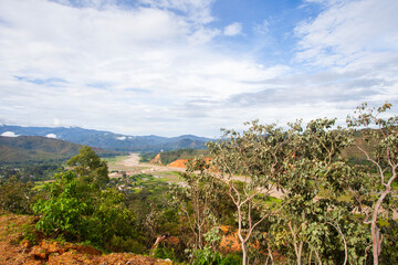 Landscape view of rural area in Aileu Regency, Timor Leste, with vegetation and other natural features, forests, rivers and hills.