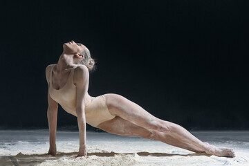 Dancing in flour dancer posing on a studio background