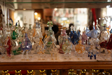 Colorful glass perfume bottles shining on display in marsa alam, egypt