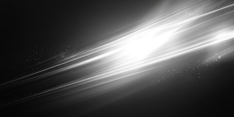 abstract black and white image with bright light streaks, creating a dynamic and energetic visual. The light appears to radiate from a central source