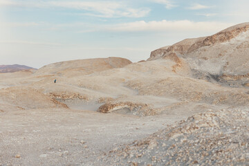 Geologist walking in the eastern desert of egypt near marsa alam