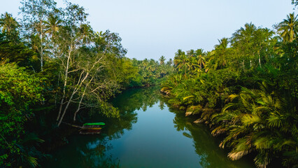 Serene waters reflect lush greenery in Chumphon Thailand on a tranquil morning