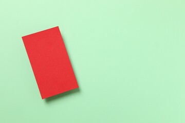 Red paper card on color background