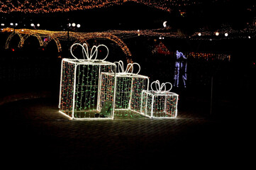 New Year's light installation in the form of three large boxes with gifts
