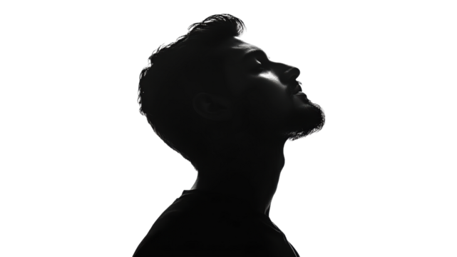 Thoughtful man gazing upward silhouette