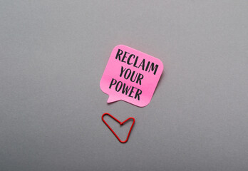 Pink sticky note with the words Reclaim Your Power written on it