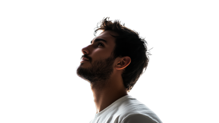 Man thoughtfully gazing upward indoors