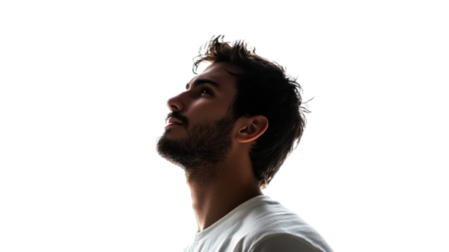 Man thoughtfully gazing upward indoors