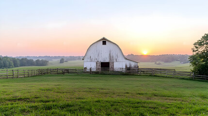 Sunrise over white barn, rural landscape, peaceful morning, farm scene, stock photo