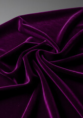 Obraz premium Luxurious deep purple velvet fabric background with smooth texture for elegant presentations 