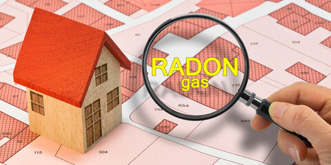 RADON GAS TESTING - Concept with magnifying glass and home model