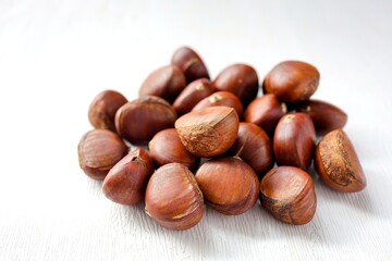 Pile chestnut  on white background
