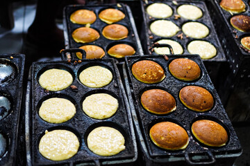 The process making Apem Cake or Kue Apem at Ngasem market (traditional market) in Yogyakarta, Indonesia. Kue Apem is traditional Javanese snacks made from rice flour.