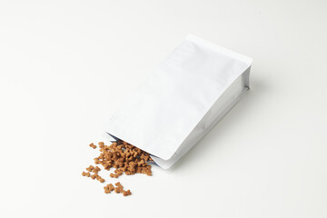 Package of Pet Food Spilled on a Clean Surface in a Bright Environment
