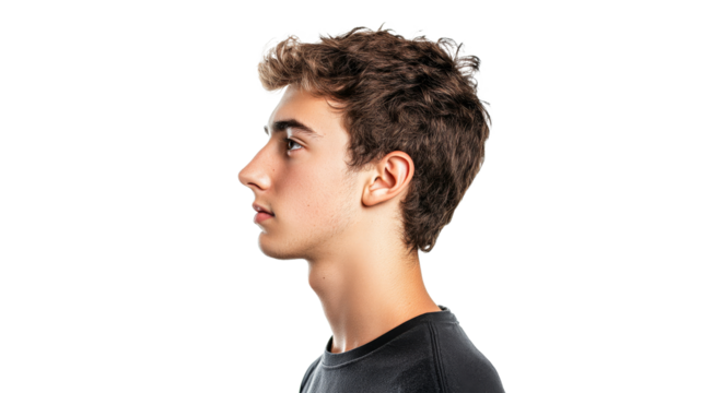 Young man in profile against a plain background