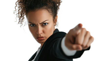 A curly haired woman points her finger at the camera with an angry expression