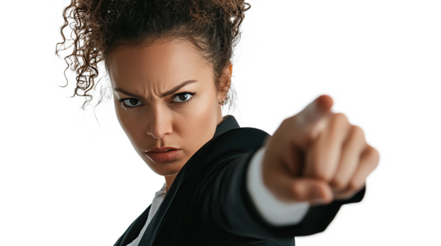 A curly haired woman points her finger at the camera with an angry expression