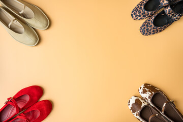 Assorted spring fashion ballet flats in vibrant and apricot tones with copy space