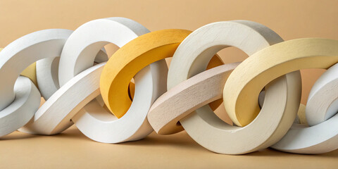  Intricately linked foam chains in white and yellow forming a complex interwoven structure with a modern artistic composition