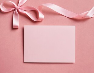 A blank pink card with a satin ribbon, perfect for invitations or notes.